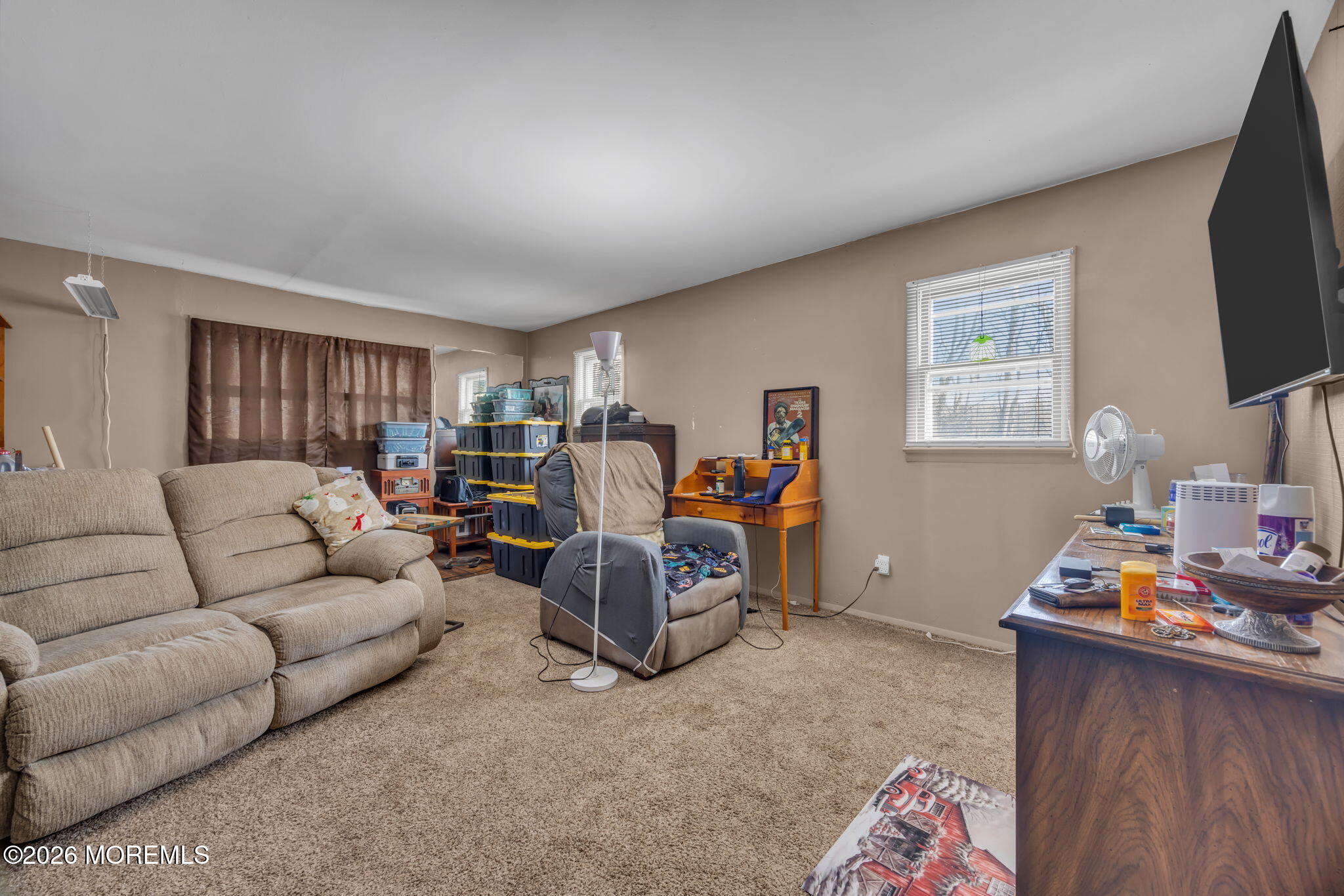 141 Jackson Mills Road Freehold, NJ 07728 - Photo 22 of 39 a living room with furniture a flat screen tv and a window