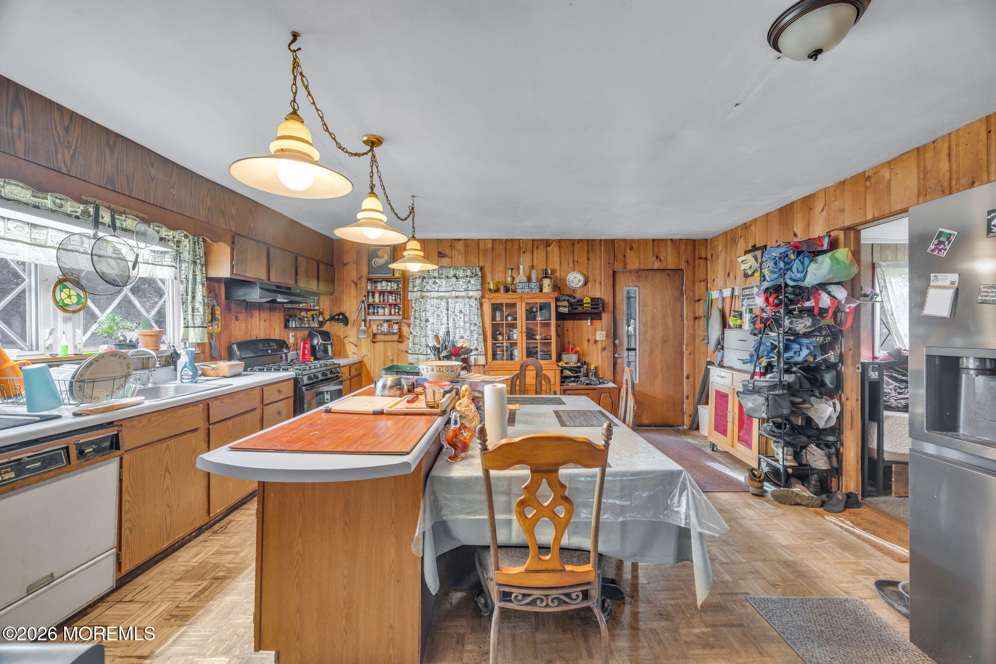 141 Jackson Mills Road Freehold, NJ 07728 - Photo 5 of 39 a dining room with furniture a chandelier and a rug