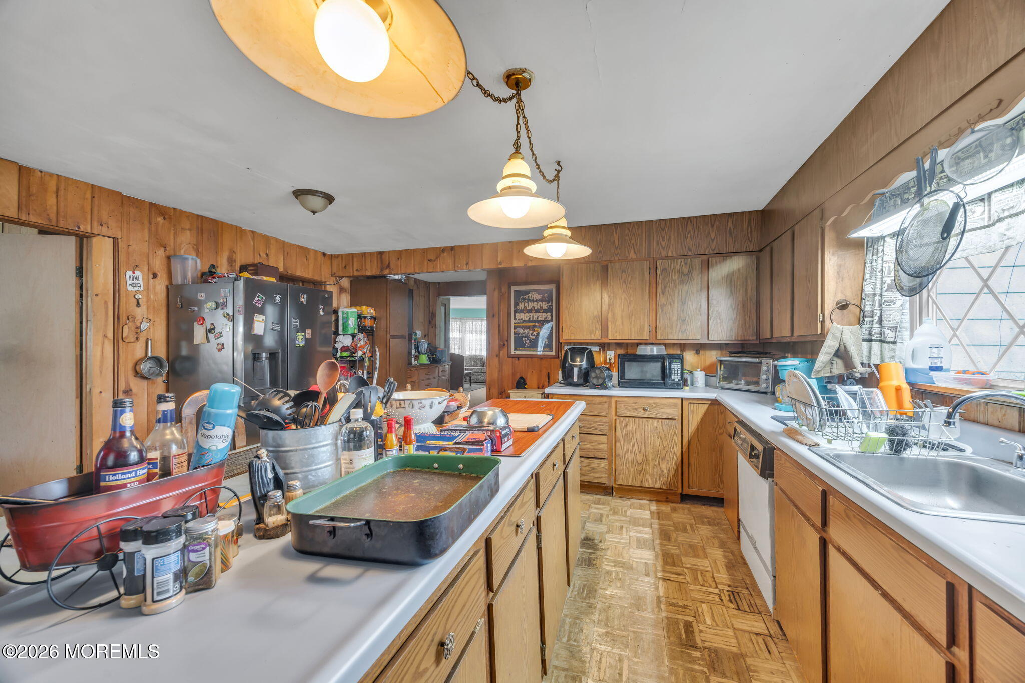 141 Jackson Mills Road Freehold, NJ 07728 - Photo 7 of 39 a kitchen with stainless steel appliances granite countertop a sink a stove and a wooden floors
