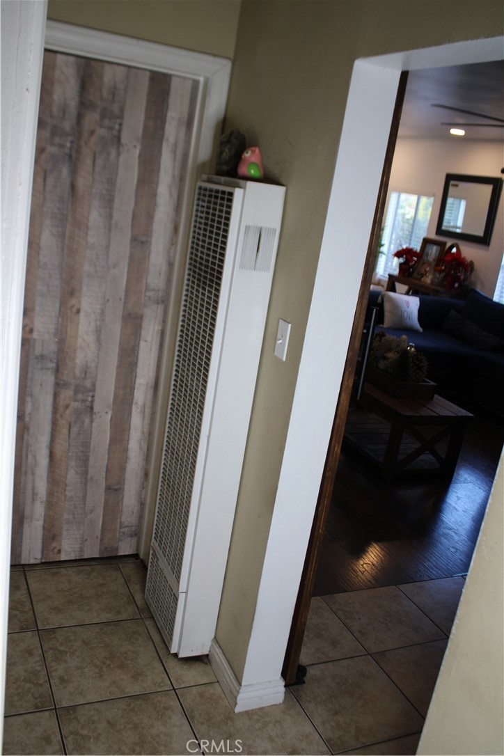 2412 West Alondra Boulevard Compton, CA 90220 - Photo 18 of 32 a view of a hallway and a car parked in a room