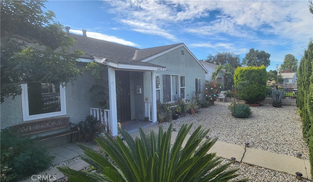 2412 West Alondra Boulevard Compton, CA 90220 - Photo 2 of 32 a view of a house with porch and garden