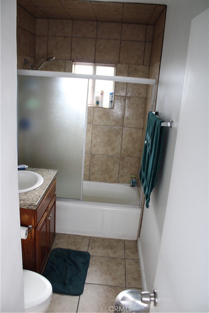 2412 West Alondra Boulevard Compton, CA 90220 - Photo 21 of 32 a bathroom with a granite countertop sink toilet and shower