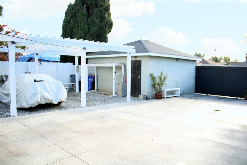 2412 West Alondra Boulevard Compton, CA 90220 - Photo 29 of 32 a view of a house with a outdoor space and porch