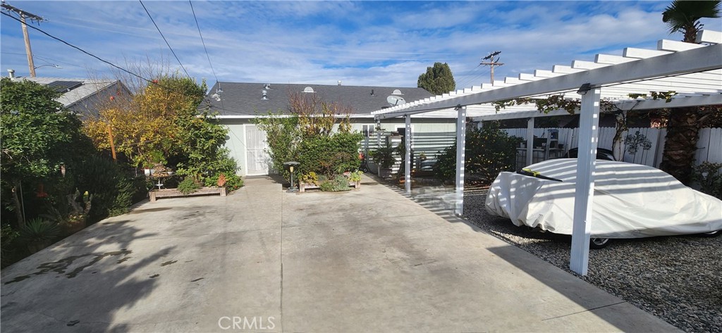 2412 West Alondra Boulevard Compton, CA 90220 - Photo 3 of 32 a view of a patio with table and chairs potted plants