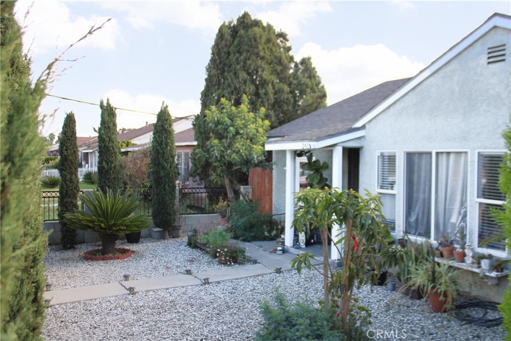 2412 West Alondra Boulevard Compton, CA 90220 - Photo 5 of 32 a front view of a house with garden
