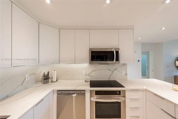 a bedroom with a bed and a flat screen television