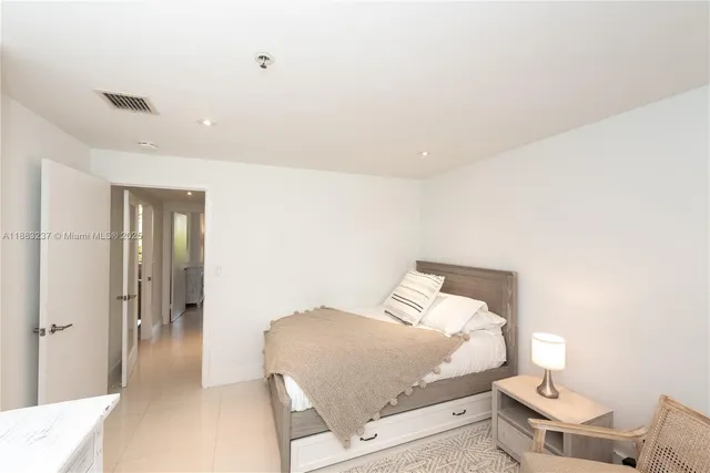 a spacious bathroom with a double vanity sink and a mirror