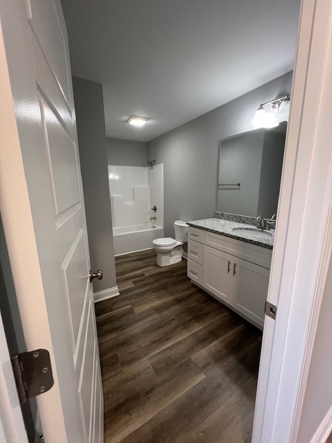 16 Cartertown Road, Unit A Scottsville, KY 42164 - Photo 8 of 15 a bathroom with a sink a mirror and a toilet