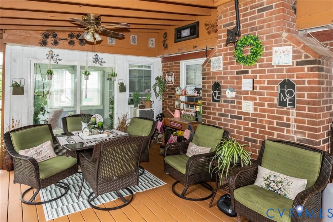5510 Alberta Road Chesterfield, VA 23832 - Photo 24 of 29 Enclosed porch featuring a brick accent wall, wood