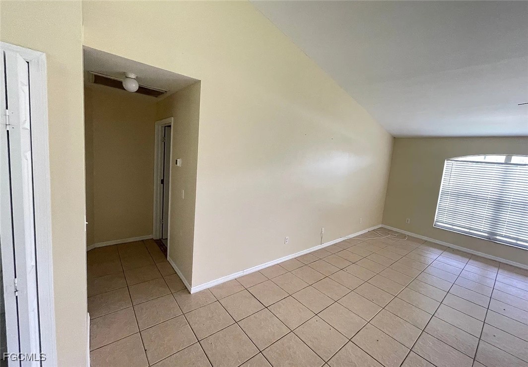 819 Abrams Boulevard Lehigh Acres, FL 33971 - Photo 4 of 10 an empty room with windows