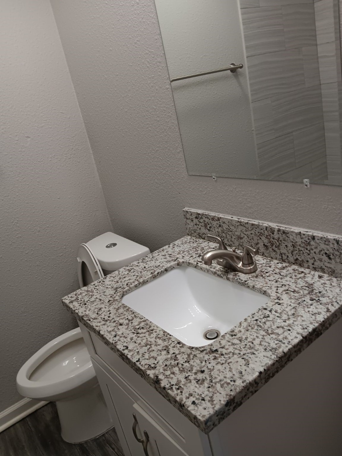 1102 Jackson Avenue Pasadena, TX 77506 - Photo 14 of 22 a bathroom with a granite countertop sink and a mirror