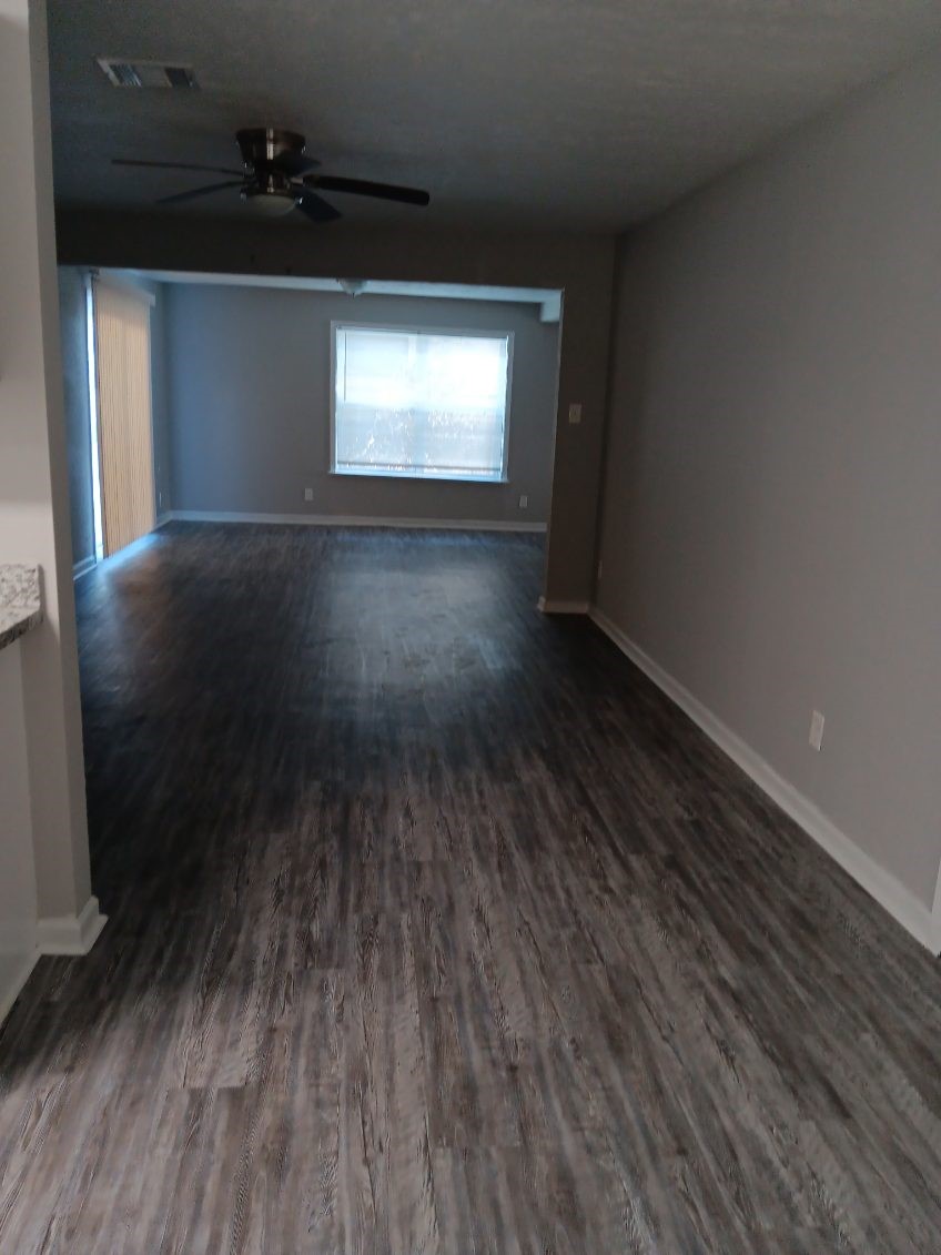 1102 Jackson Avenue Pasadena, TX 77506 - Photo 2 of 22 a view of a livingroom with wooden floor and a window
