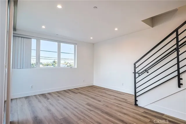 a view of kitchen with sink and wooden floor