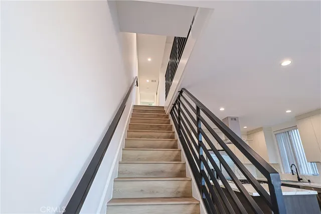 a view of hallway with wooden floor