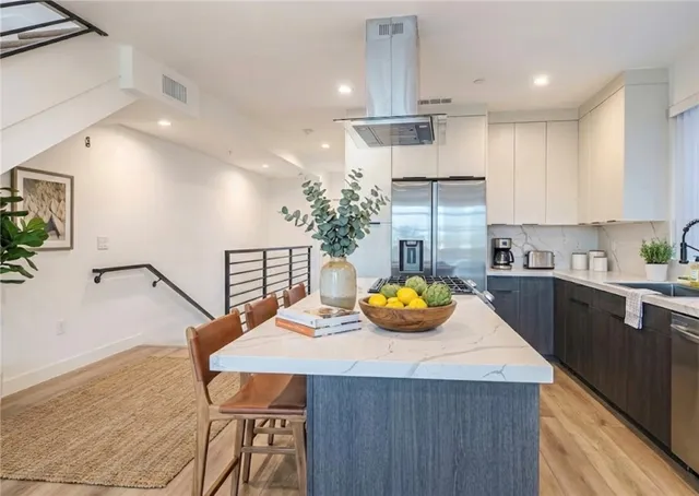 a kitchen with a table chairs and a counter top space