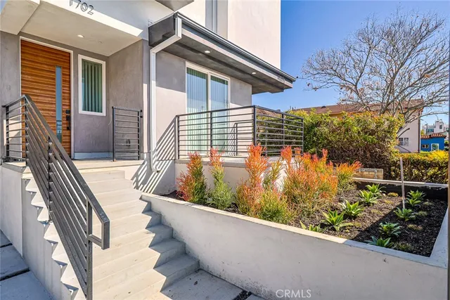a view of balcony with wooden floor and fence