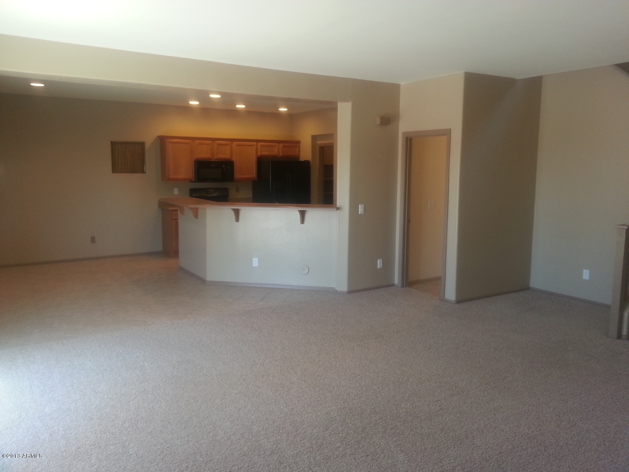 44395 Cypress Lane Maricopa, AZ 85138 - Photo 5 of 20 a view of a big room with a flat screen tv