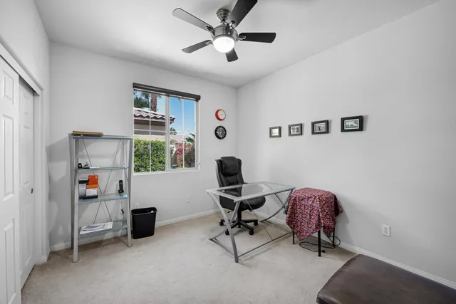 a living room with furniture and air hockey table