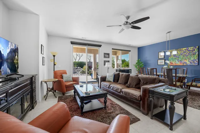 a view of a dining room with furniture and a potted plants