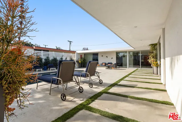 a view of a patio with sitting area