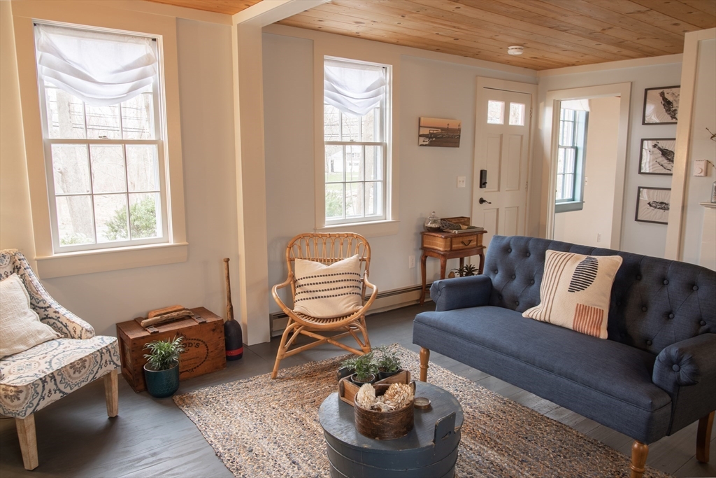1825 Main Street Barnstable, MA 02668 - Photo 13 of 33 a living room with furniture and a window