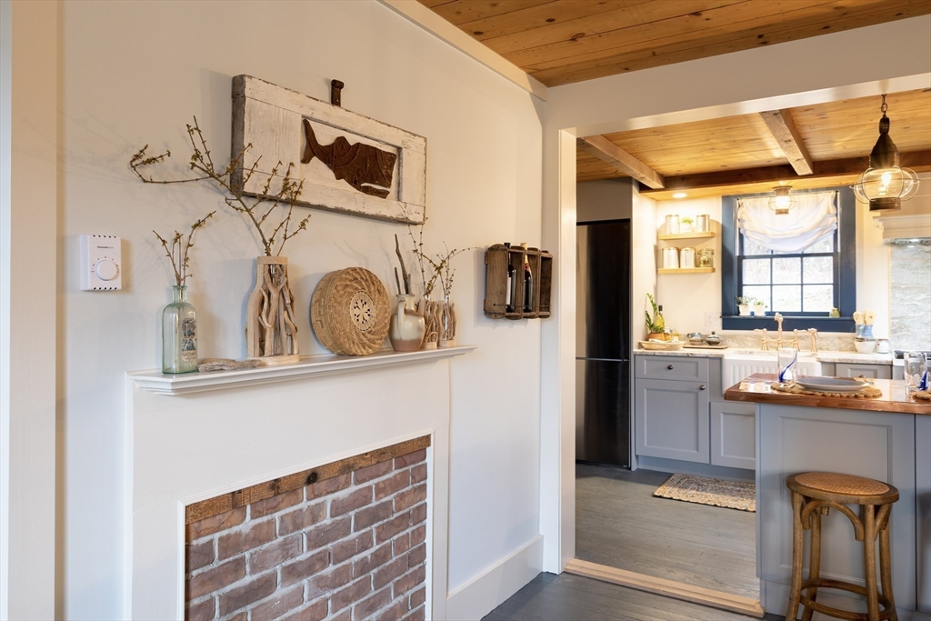 1825 Main Street Barnstable, MA 02668 - Photo 14 of 33 a kitchen with stainless steel appliances granite countertop a refrigerator and a stove top oven