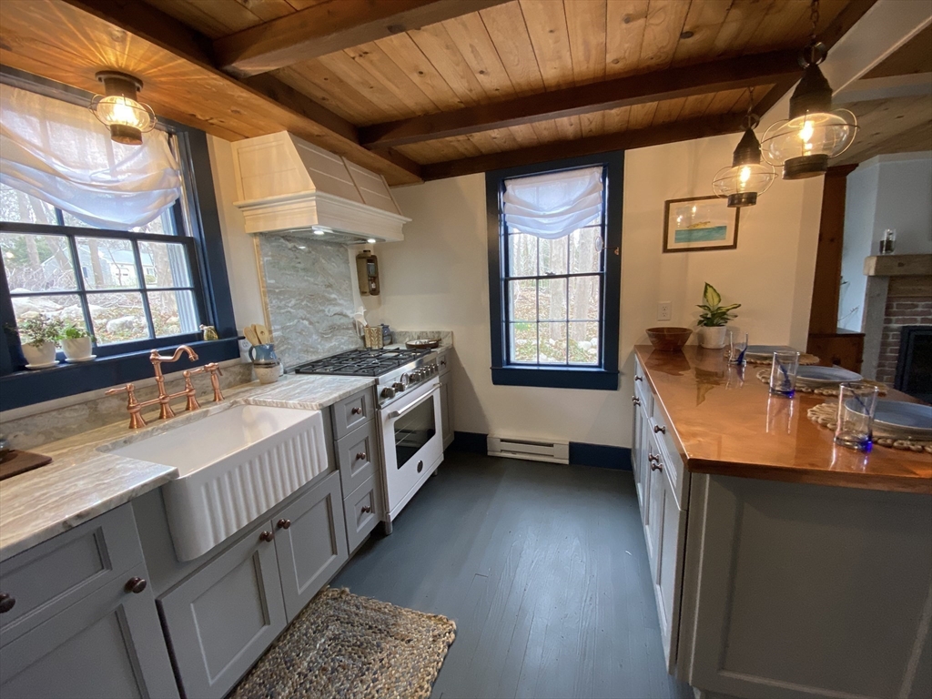 1825 Main Street Barnstable, MA 02668 - Photo 2 of 33 a kitchen that has a lot of cabinets in it