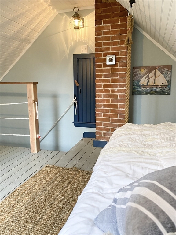 1825 Main Street Barnstable, MA 02668 - Photo 25 of 33 a bedroom with a bed and a painting on the wall