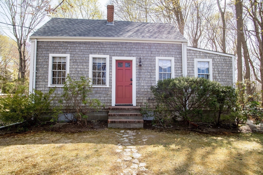 1825 Main Street Barnstable, MA 02668 - Photo 3 of 33 a front view of a house with garden