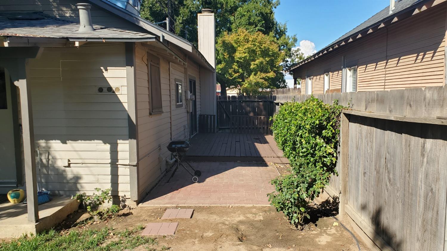 1213 M Street Reedley, CA 93654 - Photo 11 of 13 a couple of potted plants in front of door