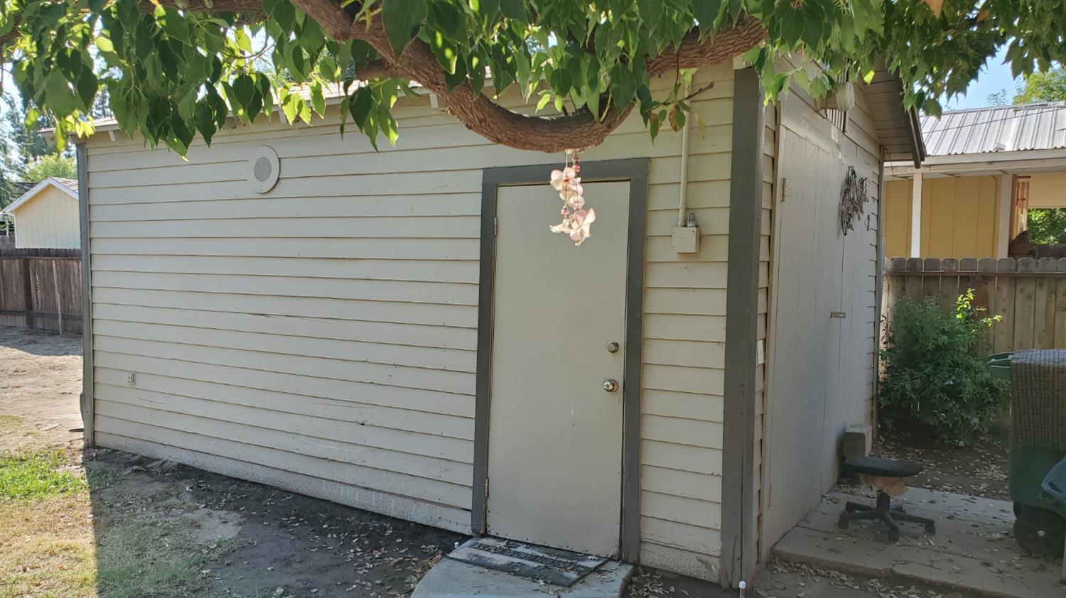 1213 M Street Reedley, CA 93654 - Photo 12 of 13 a view of a house with a yard