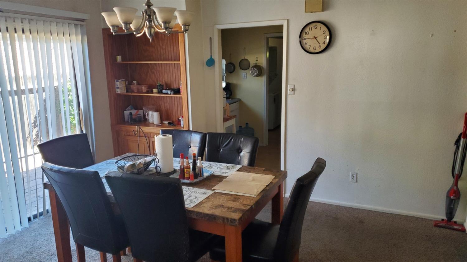 1213 M Street Reedley, CA 93654 - Photo 3 of 13 a dining room with furniture and window