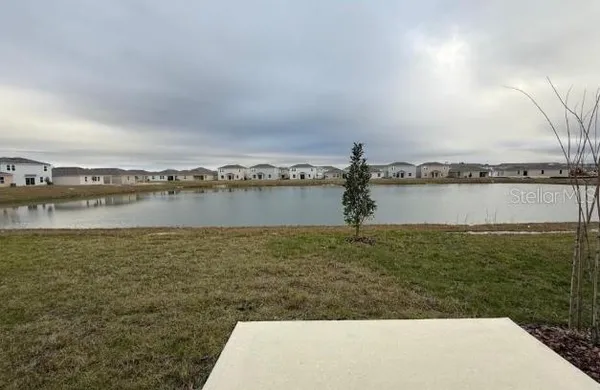 a view of a lake with a big yard