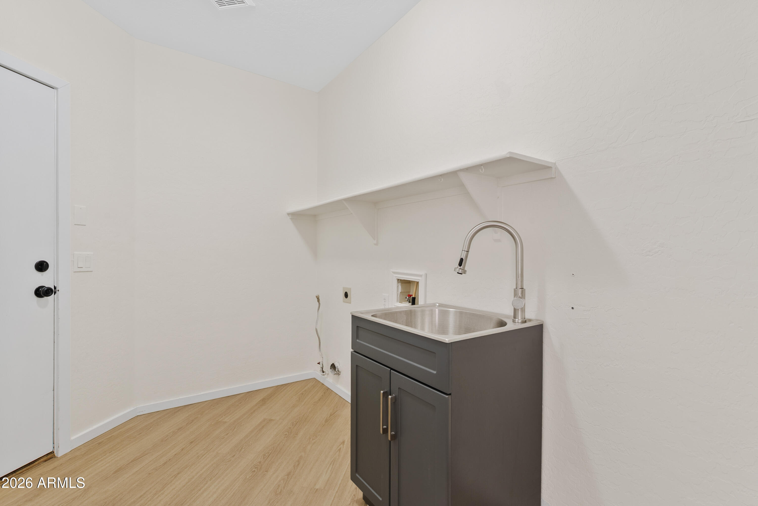 3060 North Ridgecrest, Unit 76 Mesa, AZ 85207 - Photo 18 of 46 Laundry with Utility Sink