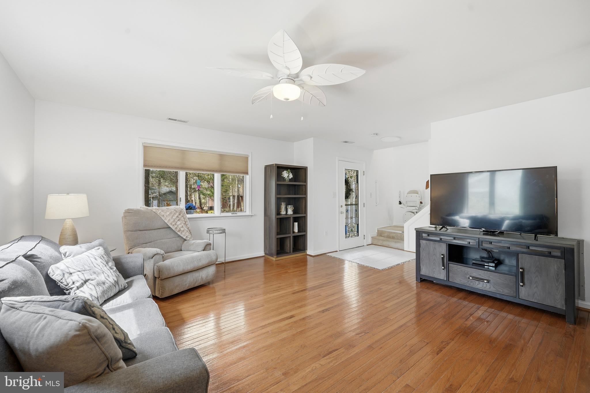 82 Sandyhook Road Berlin, MD 21811 - Photo 11 of 55 a living room with furniture and a flat screen tv
