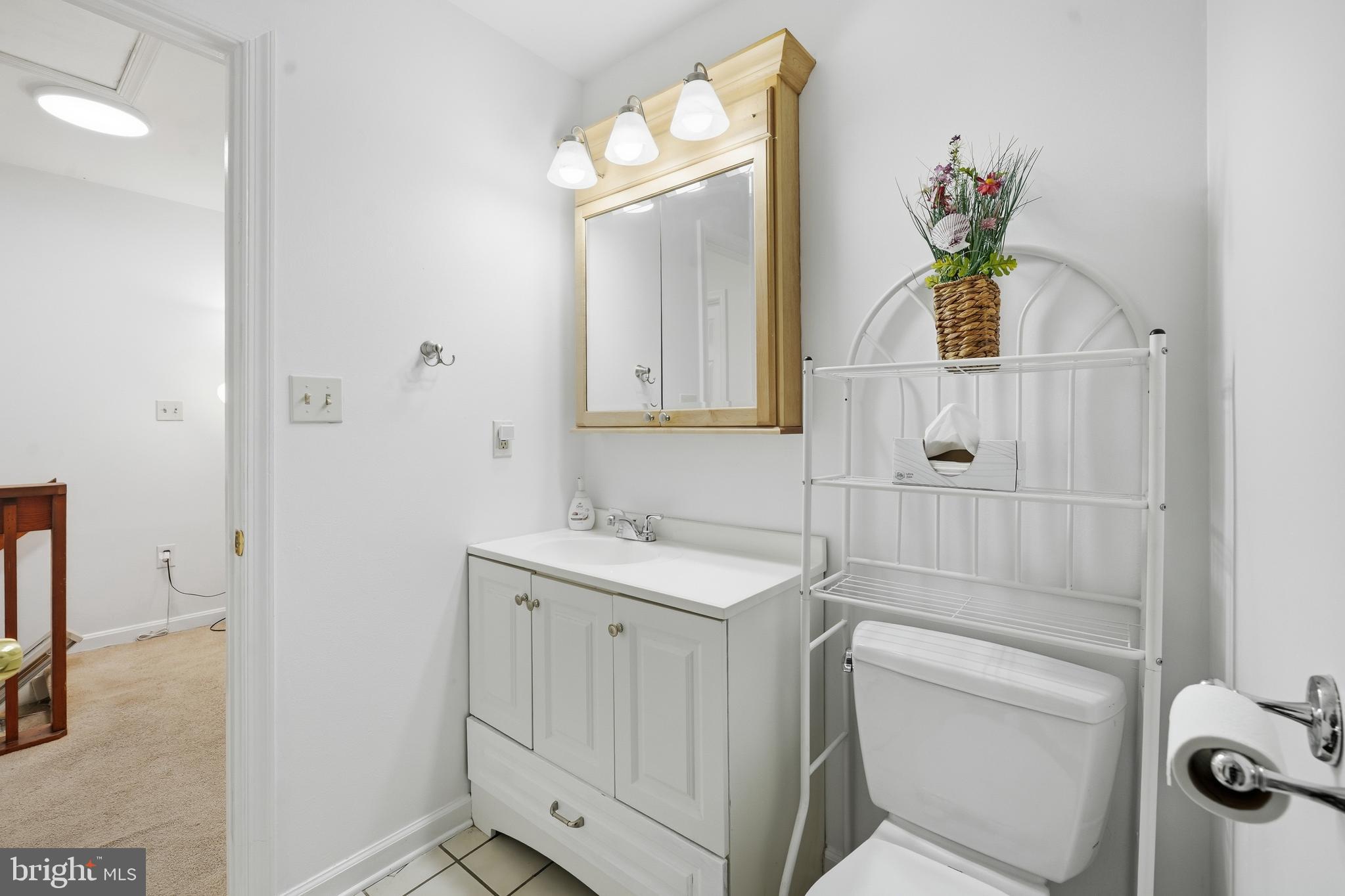 82 Sandyhook Road Berlin, MD 21811 - Photo 22 of 55 a bathroom with a toilet sink and mirror