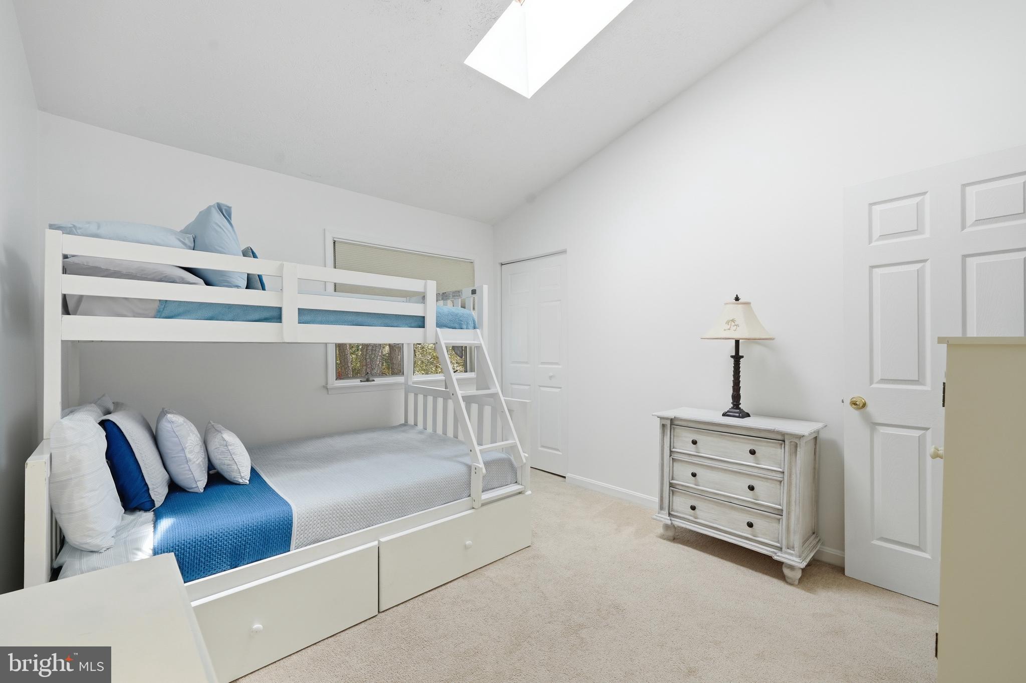 82 Sandyhook Road Berlin, MD 21811 - Photo 25 of 55 a bedroom with furniture and a shelf