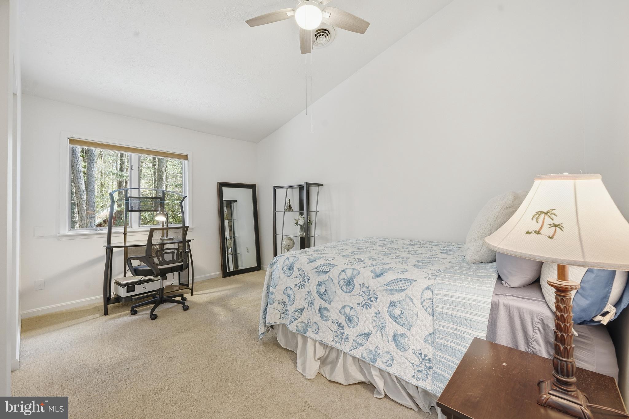 82 Sandyhook Road Berlin, MD 21811 - Photo 26 of 55 a bedroom with a bed and a chandelier