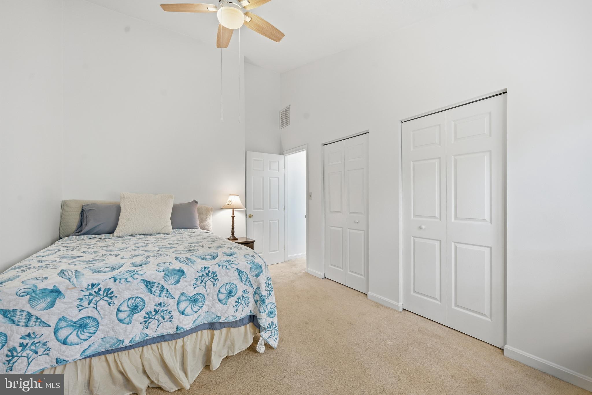 82 Sandyhook Road Berlin, MD 21811 - Photo 27 of 55 a bedroom with a bed and a chandelier fan