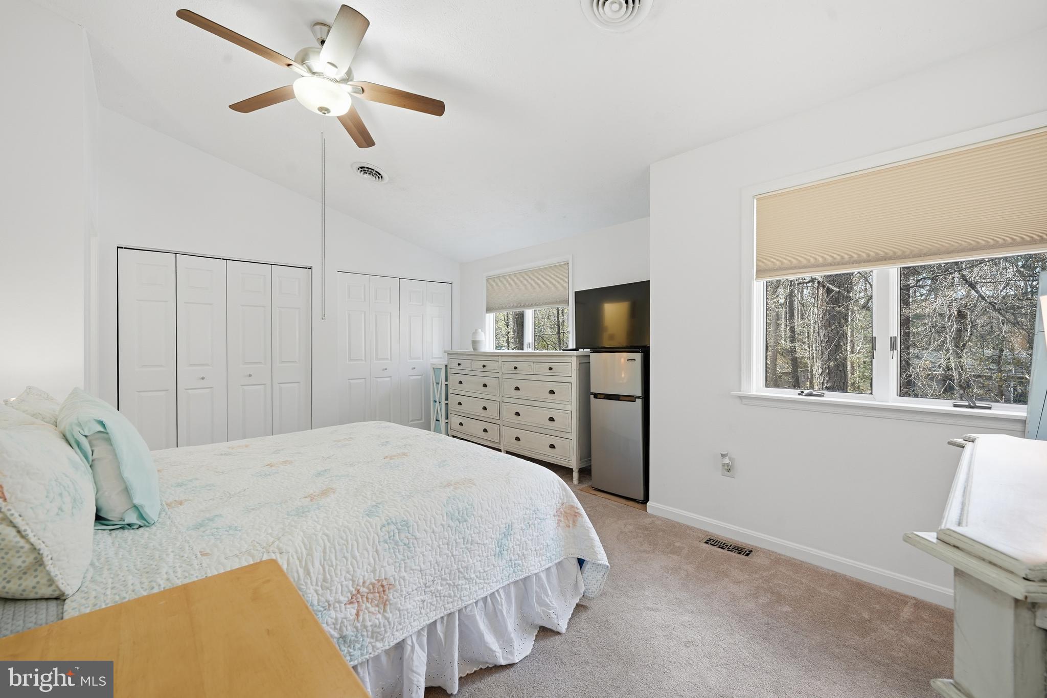 82 Sandyhook Road Berlin, MD 21811 - Photo 28 of 55 a bedroom with a bed and a chandelier