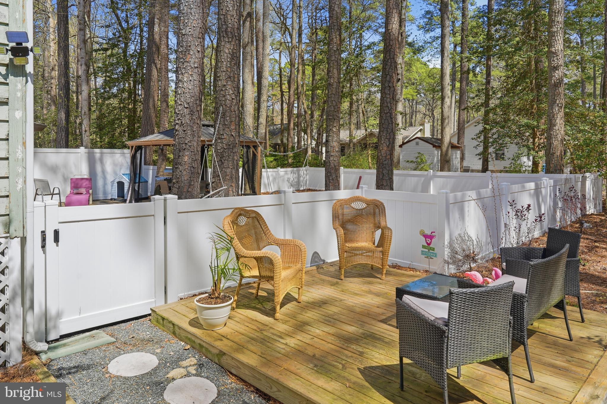 82 Sandyhook Road Berlin, MD 21811 - Photo 34 of 55 a view of a dinning table and chairs in the patio