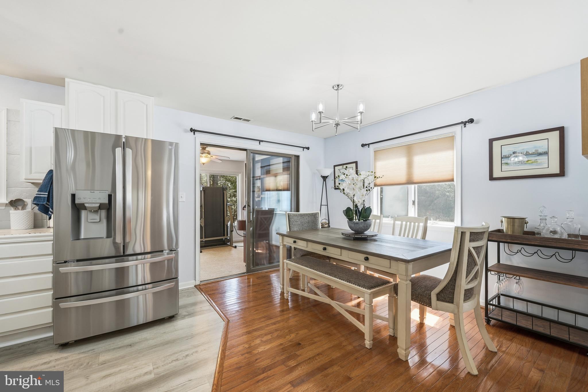 82 Sandyhook Road Berlin, MD 21811 - Photo 9 of 55 a room with stainless steel appliances granite countertop a refrigerator dining table and chairs