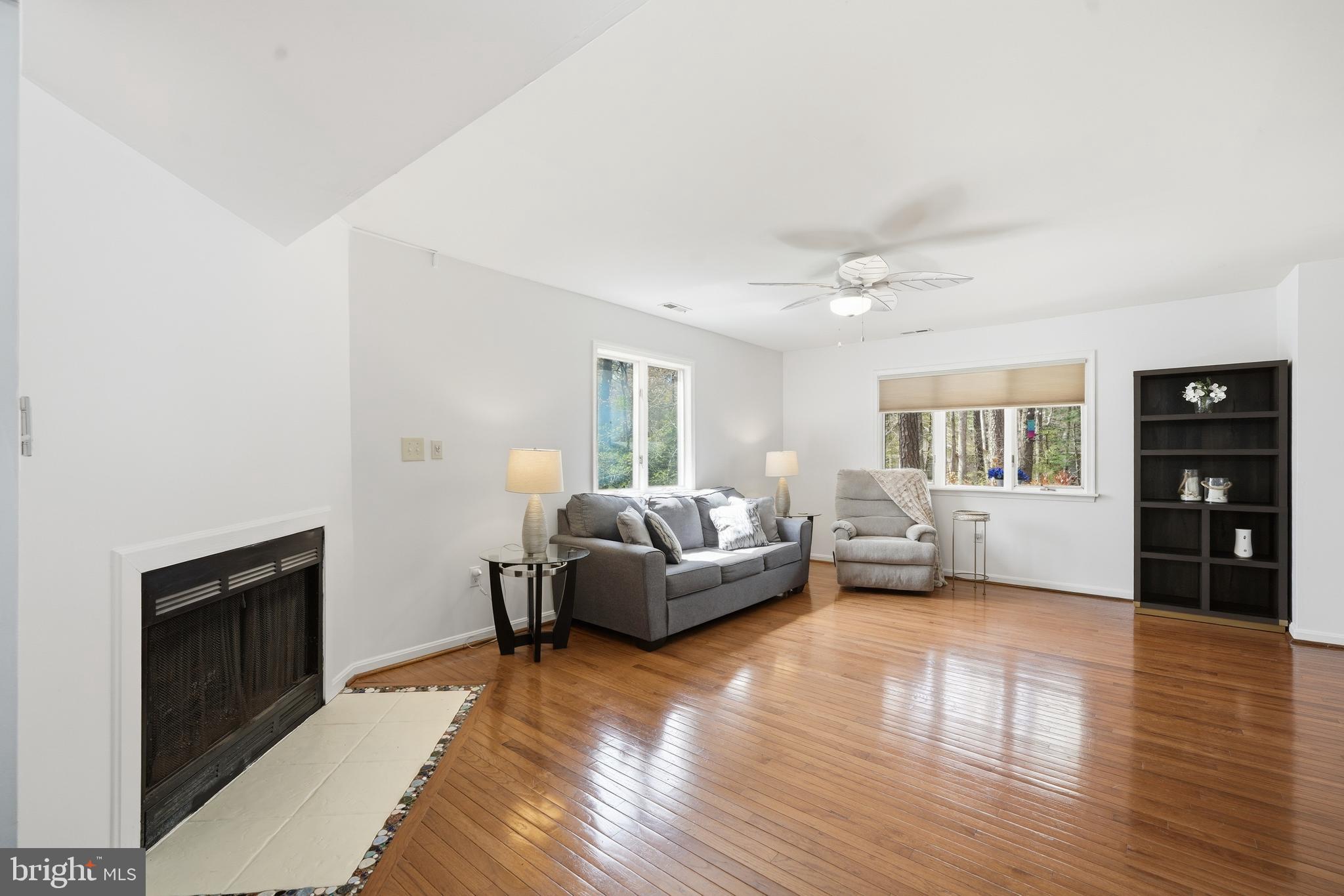 82 Sandyhook Road Berlin, MD 21811 - Photo 10 of 55 a living room with furniture and a wooden floor