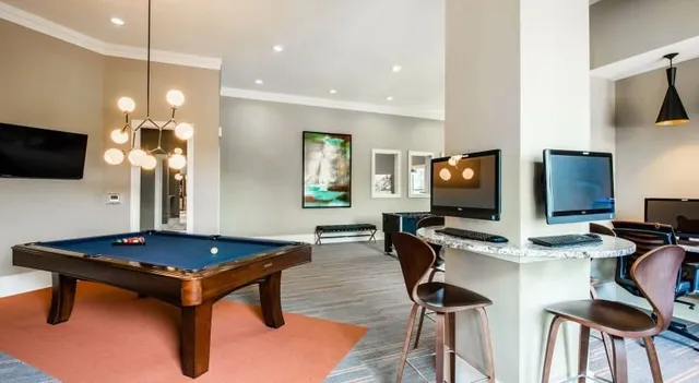 a view of swimming pool with outdoor seating and plants