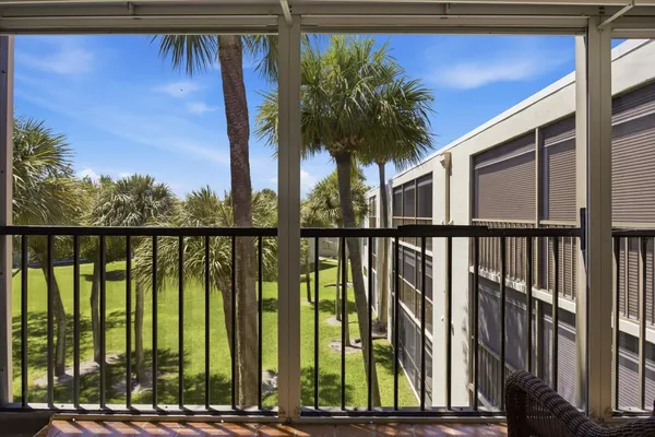a view of balcony with wooden floor