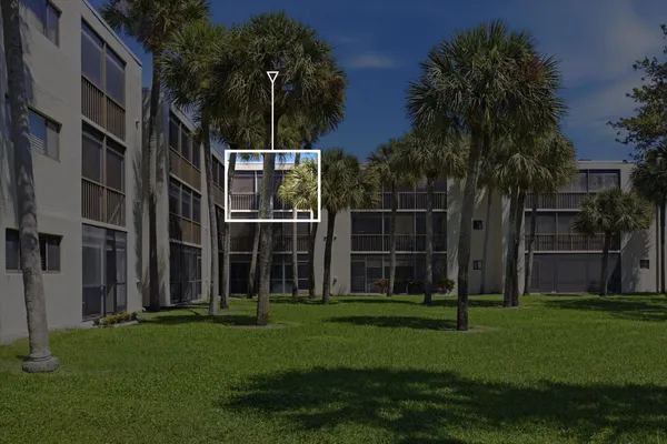 a backyard of a house with lots of green space and garden