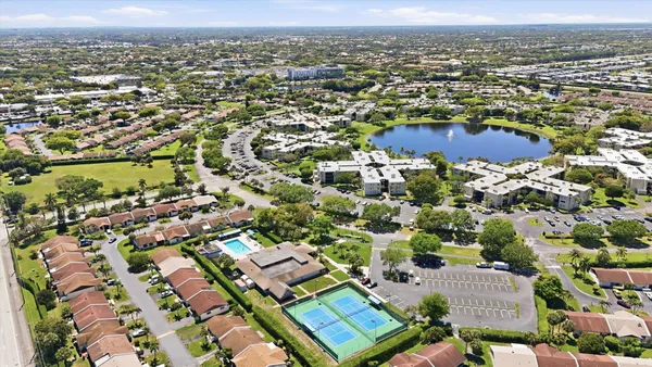 an aerial view of residential houses with outdoor space