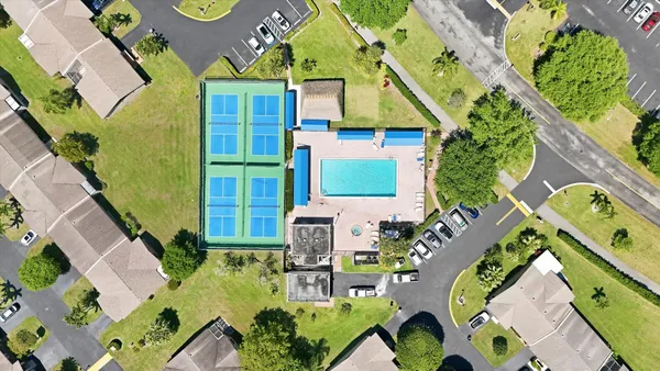 an aerial view of a houses with yard