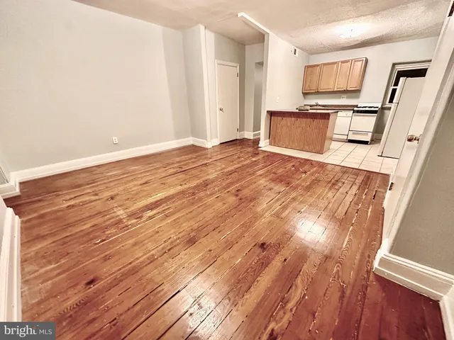 a view of kitchen with wooden floor