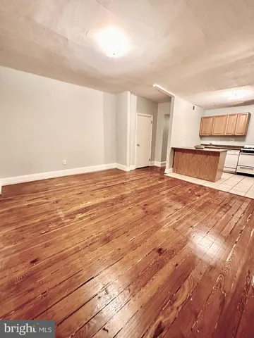a view of room with wooden floor